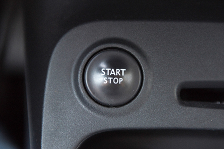 Interior of a car with closeup of  engine start stop system buttonのeditorial素材