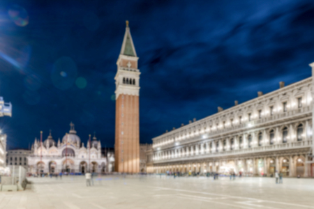 Defocused background of St. Mark's Square at night, Venice, Italy. Intentionally blurred post production for bokeh effectの写真素材