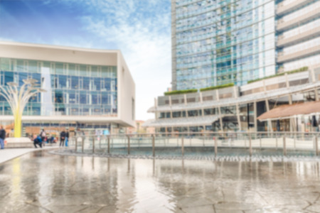Defocused background of piazza Gae Aulenti, iconic square in Milan, Italy. Intentionally blurred post production for bokeh effectの写真素材