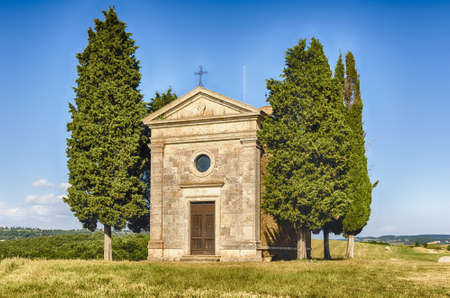 SAN QUIRICO D'ORCIA, ITALY - JUNE 23: The chapel of Madonna di Vitaleta, iconic building in the...