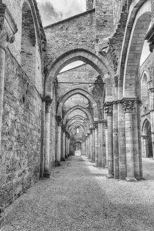 CHIUSDINO, ITALY - JUNE 22: Interior view of the iconic roofless Abbey of San Galgano, a Cistercian Monastery in the town of Chiusdino, province of Siena, Italy, on June 22, 2019のeditorial素材