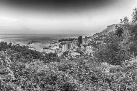 Panoramic view of Monaco at sunset from the Grande Corniche road, iconic landmark in Cote d'Azur, French Rivieraの写真素材