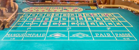 Classic roulette table with selective focus for bokeh effect. Concept for gambling and casino