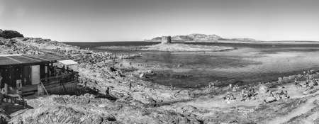 STINTINO, ITALY - AUGUST 6: Panoramic view of La Pelosa beach, one of the most beautiful seaside places of the Mediterranean, located in the town of Stintino, northern Sardinia, Italy, August 6, 2020のeditorial素材