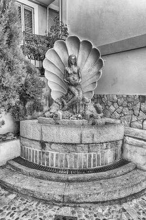 Scenic fountain in the seaside village of Chianalea, fraction of Scilla, Calabria, Italyの写真素材