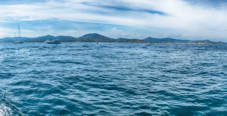 View of the old harbor with luxury yachts of Saint-Tropez, Cote d'Azur, France. The town is a worldwide famous resort for the European and American jet set and touristsの写真素材