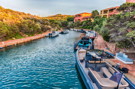View of the harbor of Porto Cervo, Sardinia, Italy. The town is a worldwide famous resort and a luxury yacht magnet and billionaires' playgroundの写真素材
