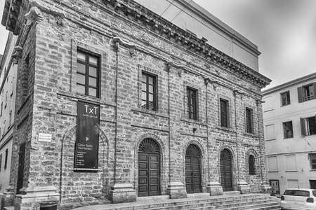 ALGHERO, ITALY - AUGUST 6: Facade of the Municipal theater located in the historic center of Alghero, Sardinia, Italy, August 6, 2020のeditorial素材