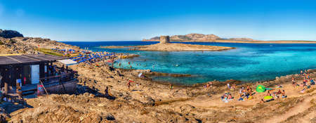 STINTINO, ITALY - AUGUST 6: Panoramic view of La Pelosa beach, one of the most beautiful seaside places of the Mediterranean, located in the town of Stintino, northern Sardinia, Italy, August 6, 2020のeditorial素材