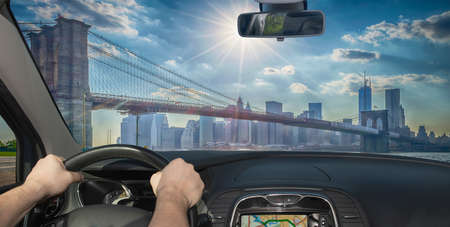 Driving a car towards the iconic Brooklyn Bridge, one of the major landmarks in New York City, USA
