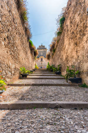 The steps to the Roman Catholic Cathedral of Saint Bartholomew, in the heart of the citadel of Lipari, Aeolian Islands, Italyの写真素材