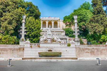 The classical Fontana del Nettuno, monumental fountain located in the Piazza del Popolo in Rome, Italyの写真素材