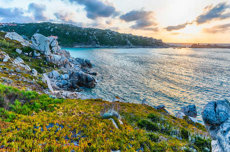 Scenic sunset over the sea among the beautiful granite rocks of Santa Teresa Gallura, northern Sardinia, Italyの写真素材