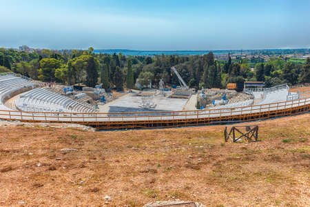 View of the Greek theater of Syracuse, iconic landmark in the archaelogical park of Syracuse, Sicily, Italyの写真素材
