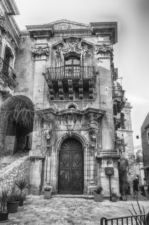 RAGUSA, ITALY - AUGUST 13, 2021: Facade of the Palazzo della Cancelleria, baroque building and iconic landmark in Ragusa, Sicily, Italyのeditorial素材