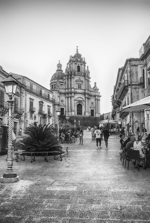 RAGUSA, ITALY - AUGUST 13, 2021: Facade of the Saint George Cathedral, Baroque masterpiece and major landmark in the main square of Ibla district, Ragusa, Italyのeditorial素材