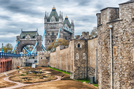Scenic view of Tower of London outer wall with Tower Bridge in the background, London, England, UKの写真素材