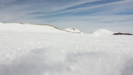 Scenic winter landscape with snow, located in Campocatino, touristic ski town in the Central Apennines, Italyの写真素材