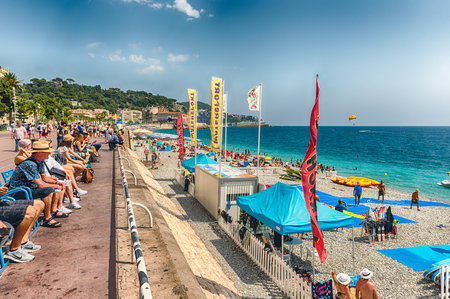 NICE, FRANCE - AUGUST 11: An ordinary summer day on the Promenade des Anglais, iconic walkway along the beachfront in central Nice, Cote d'Azur, France, on August 11, 2019のeditorial素材