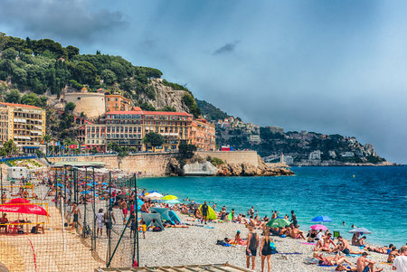 NICE, FRANCE - AUGUST 11: An ordinary summer day on the beachfront along the Promenade des Anglais, iconic walkway in central Nice, Cote d'Azur, France, on August 11, 2019のeditorial素材