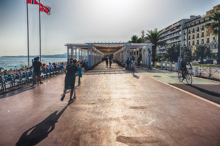 NICE, FRANCE - AUGUST 11: An ordinary summer day on the Promenade des Anglais, iconic walkway along the beachfront in central Nice, Cote d'Azur, France, on August 11, 2019のeditorial素材