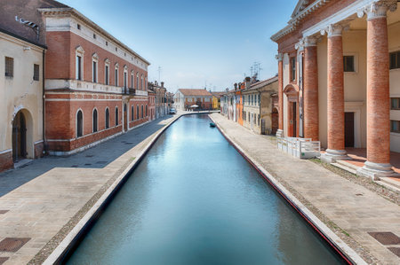 Walking in the center of Comacchio, picturesque town with canals and bridges in the province of Ferrara, Italyの写真素材