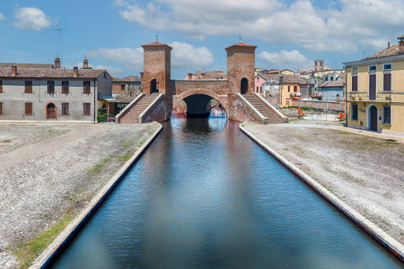 View over the Trepponti Bridge, a masonry arch bridge and iconic landmark in Comacchio, Italyの写真素材