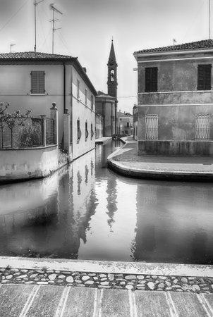 Walking in the center of Comacchio, picturesque town with canals and bridges in the province of Ferrara, Italyの写真素材