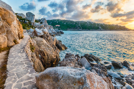 Scenic sunset over the sea among the beautiful granite rocks of Santa Teresa Gallura, northern Sardinia, Italyの写真素材