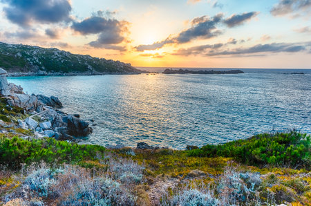 Scenic sunset over the sea among the beautiful granite rocks of Santa Teresa Gallura, northern Sardinia, Italyの写真素材