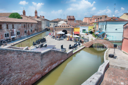 View over the Trepponti Bridge, a masonry arch bridge and iconic landmark in Comacchio, Italyの写真素材