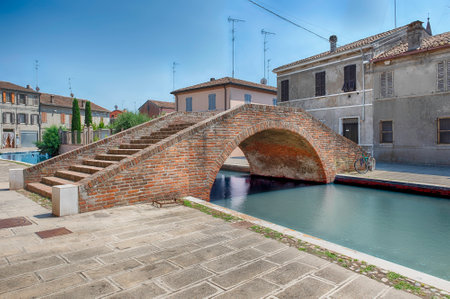 Walking in the center of Comacchio, picturesque town with canals and bridges in the province of Ferrara, Italyの写真素材
