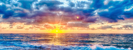 Sunset on the Mediterranean sea with a scenic cloudy sky, Italyの写真素材