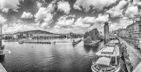 Panoramic view of Vltava River with tour boats and historic architecture in Prague, Czech Republicの写真素材