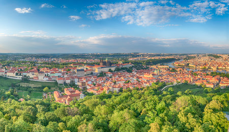 Panoramic view of the city center of Prague, Czech Republic, with the Vltava River flowing through it, as seen from Petrin hillの写真素材