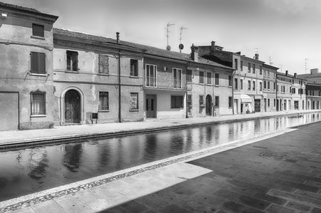 Walking in the center of Comacchio, picturesque town with canals and bridges in the province of Ferrara, Italyの写真素材