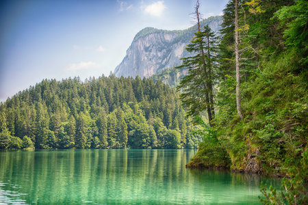 Panoramic view of the beautiful Lake Tovel with the Brenta Dolomites in the background on a sunny...