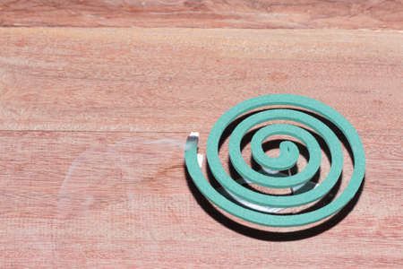 Mosquito coils. Mosquito repellent on the wooden floor.の写真素材
