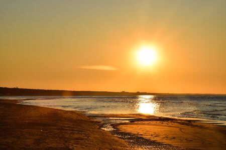Gold tone sunset at the Baltic Seaの写真素材