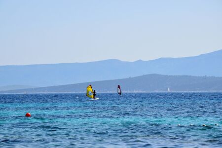 People are having an active pastime on vacation. Surfing on an Adriatic sea in Croatia.の写真素材