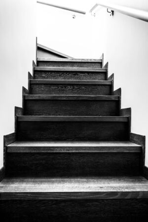 Stairs made of wood leading up. Interior design details.の写真素材