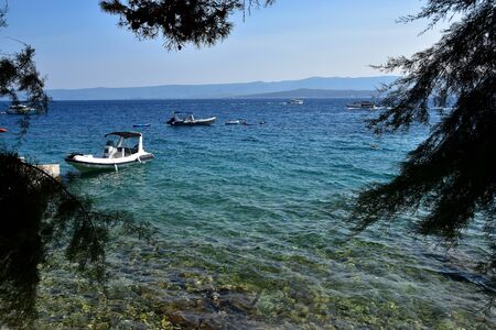 Seascape view with small boats in Croatia, Bol Island.