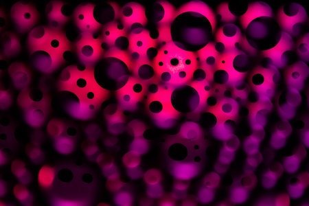 Background of colourful surreal and chaotic abstract light circles.
