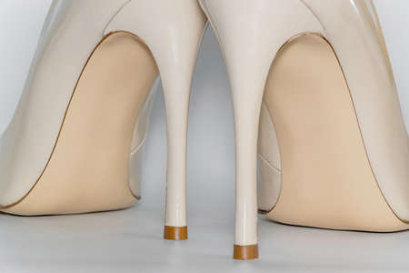 Back view of the nude beige colored high heeled womens shoes.の写真素材