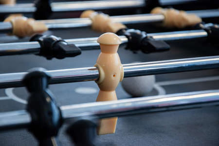 Close up of childrens table football game with players and a ball.