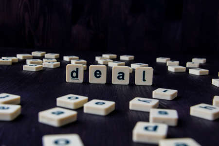 Word or phrase DEAL made with  letters on the wood, great image for your design.の写真素材