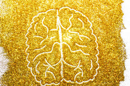 a composition with brain on beautiful gold glitter. Background and texture of gold glitter. Luxury gold glitter sparkle shining texture backgroundの写真素材