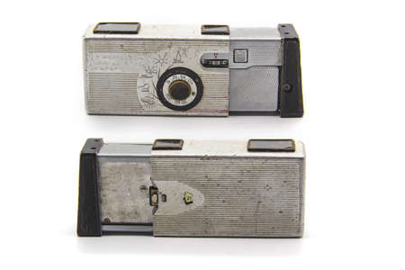Vintage old photo camera from two sides on the white background