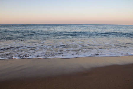 Beautiful seascape with sea waves and sand. Sea waves on the beach.の写真素材