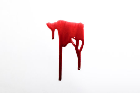 A blood spatter. A blood flowing down. Bloody pattern. Concepts of blood can be used in designの写真素材